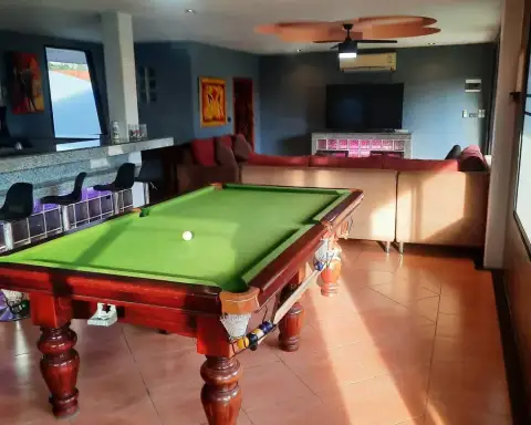 2 Bedroom House for Rent in Mabprachan private outdoor swimming pool beside traditional Thai-roofed house