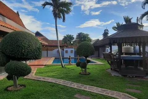 2 Bedroom House for Rent in Mabprachan spacious living room with sectional sofas, pool table, and bar counter