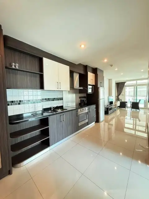 1 Bedroom Condo for Sale at Siam Ocean View modern kitchen with dark cabinetry and stainless steel appliances