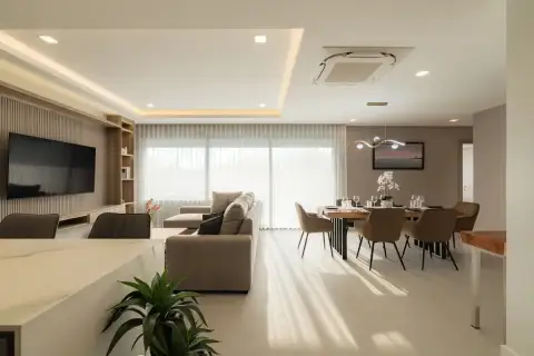 3 Bedroom Condo for Sale at Zensiri Estates and Residences spacious living and dining area with large windows and cove ceiling lighting
