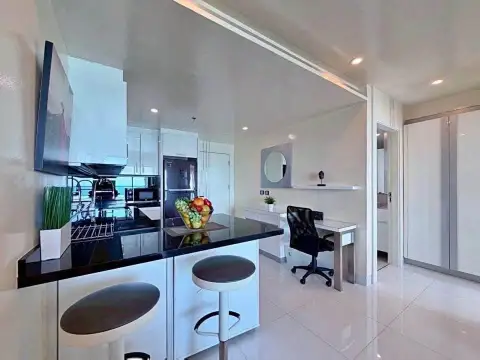 1 Bedroom Condo for Sale at Sky Residences Pattaya kitchen island with bar stools and study desk
