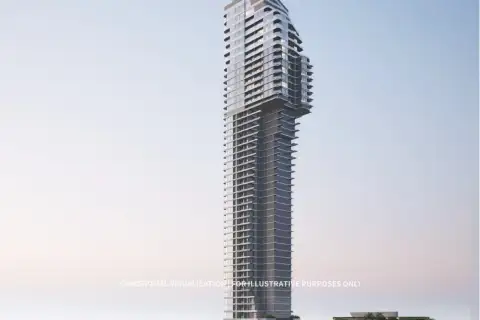 2 Bedroom Condo for Sale at Soondri Wongamat exterior view of the modern high-rise tower at dusk