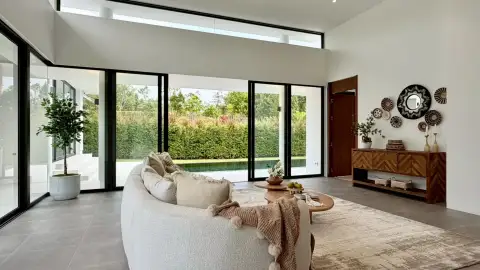 2 Bedroom House for Sale at Sunplay Bangsaray open living area with potted plant, wall decor and garden view