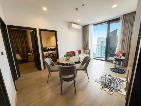 2 Bedroom Condo for Sale at EDGE Central Pattaya open-plan living and dining space with balcony access