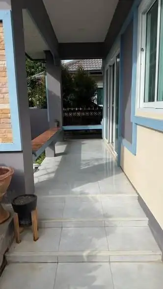 3 Bedroom House for Sale in Takhian Tia covered side patio walkway with tiled flooring and seating bench