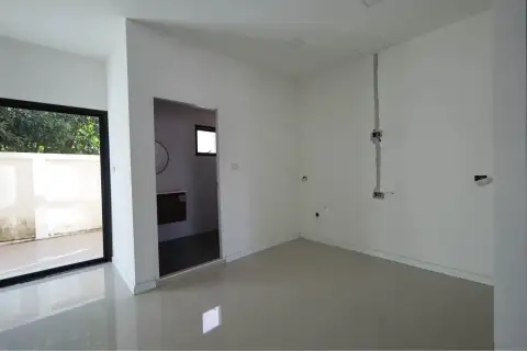 4 Bedroom Townhouse for Sale in Takhian Tia empty room with sliding glass door, doorway, and exposed wall wiring