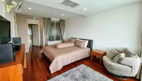 2 Bedroom Condo for Sale at The Elegance bedroom with wood flooring, bed, and armchair