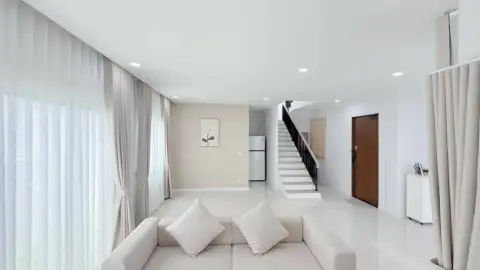 3 Bedroom House for Rent at The Palm Grandio's open living space with staircase and tiled flooring