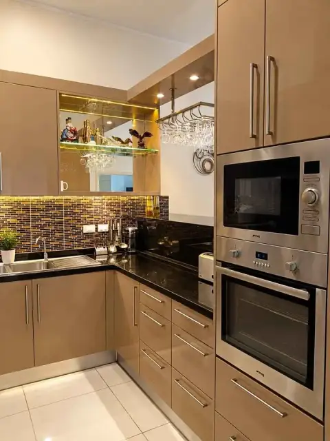 1 Bedroom Condo for Sale at The Residence Jomtien modern kitchen with built-in oven and glass-front cabinets