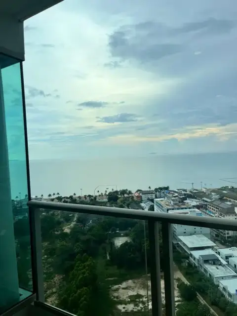 Studio Condo for Rent at The Riviera Jomtien balcony view overlooking Jomtien coastline and sea