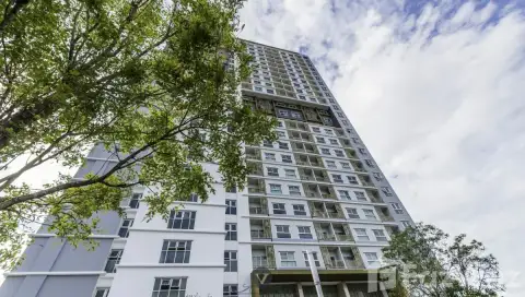 The Trust Condo South Pattaya high-rise condo tower exterior viewed from below against a cloudy sky