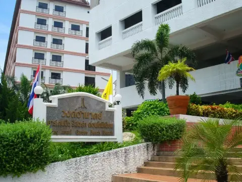Wongamat Garden Beach Resort entrance sign with landscaped garden and building facade