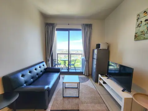 1 Bedroom Condo for Sale & Rent at Unixx South Pattaya living room with leather sofa and balcony city view