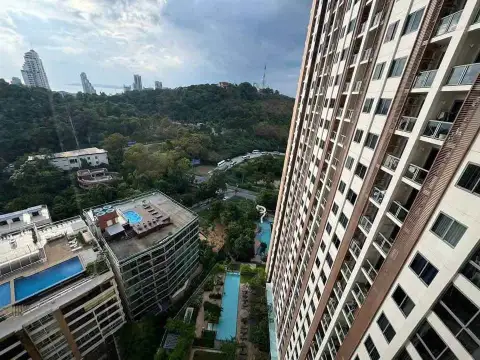 1 Bedroom Condo for Sale at Unixx South Pattaya aerial view of pool decks and surrounding high-rises