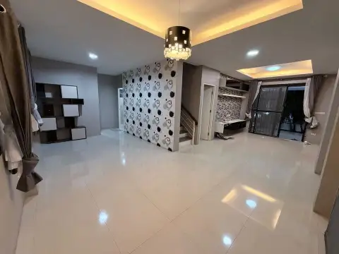 4 Bedroom House for Rent in East Pattaya open living area with patterned accent wall and staircase
