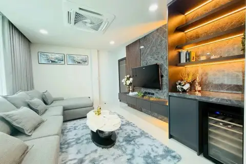 5 Bedroom House for Rent at View Point Village cozy living room with wine cooler and marble TV wall