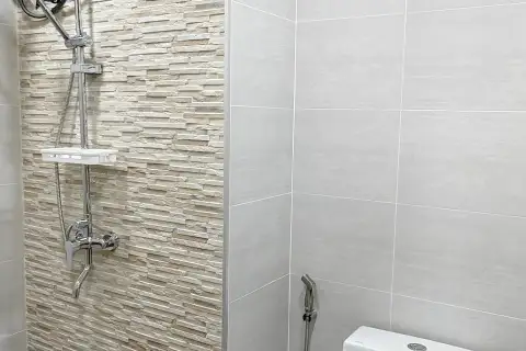 1 Bedroom Condo for Sale at View Talay 8 bedroom with wooden wardrobe, vanity mirror, and balcony sea view