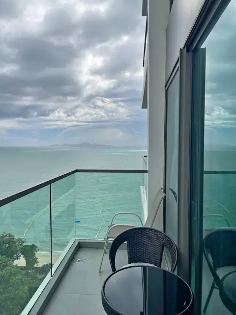 1 Bedroom Condo for Sale at Wongamat Tower balcony with panoramic sea view and seating