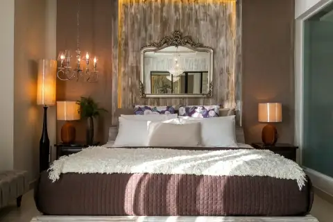 1 Bedroom Condo for Sale at Cetus Beachfront bedroom with king bed, ornate gilt mirror headboard and matching bedside lamps