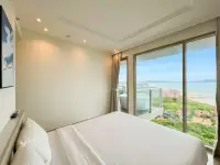 2 Bedroom Condo for Sale at Riviera Monaco bedroom with king bed and framed wall art
