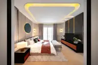 4 Bedroom House for Sale at Chieftain master bedroom with LED cove ceiling, upholstered headboard, wood flooring, and balcony doors