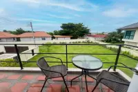 3 Bedroom House for Sale at Villa Asiatic upper balcony with rattan chairs and glass table overlooking garden