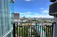 1 Bedroom Condo for Sale at The Twin Tower Jomtien Beach Pattaya balcony view overlooking Pattaya cityscape and rooftop pool