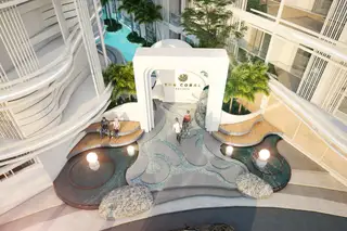 The Coral Pattaya, grand entrance with archway, water features, and decorative paving.