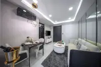 1 Bedroom Condo for Sale at Grand Solaire Noble open-plan living and dining area with gold chandelier and marble floors