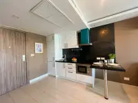 1 Bedroom Condo for Sale at Grand Avenue Residence kitchenette with white cabinets and breakfast bar