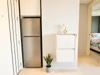 1 Bedroom Condo for Sale at MaxxCity Condo entryway with stainless steel refrigerator and storage cabinet