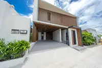 5 Bedroom House for Sale in Bang Lamung front facade with Villa Solara signage, wood slat cladding and spacious driveway