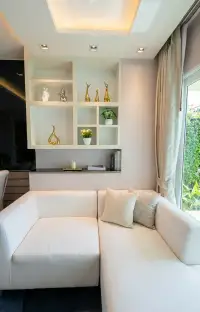 1 Bedroom Condo for Sale at La Santir cozy sofa corner with decorative shelving and garden view
