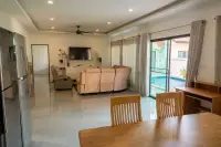 3 Bedroom House for Sale at Siam Executive Estate open-plan living area with dining table and pool view