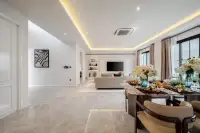 4 Bedroom House for Sale at Chieftain spacious living room with marble flooring, TV wall feature and dining area