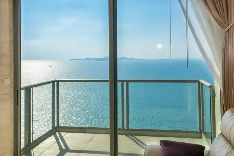 1 Bedroom Condo for Sale at Riviera Wong Amat Beach glass balcony with panoramic turquoise sea and island views