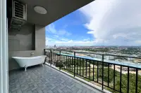 1 Bedroom Condo for Sale at The Twin Tower Jomtien Beach Pattaya balcony with freestanding clawfoot bathtub and sweeping Pattaya city view
