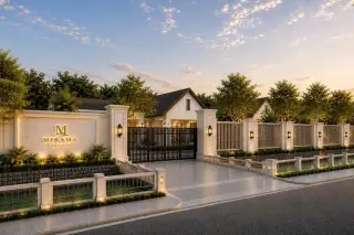 Mirama Pattaya gated entrance with illuminated signage and landscaped gardens at dusk
