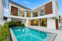 3 Bedroom House for Sale at Areeya Villa: Modern white exterior with private swimming pool and lush greenery.