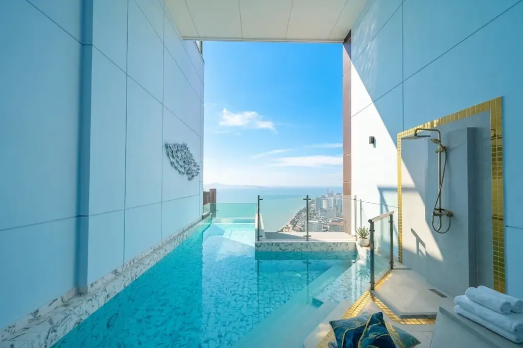 1 Bedroom Condo for Sale at Copacabana Beach Jomtien private plunge pool with ocean and city view, outdoor shower.