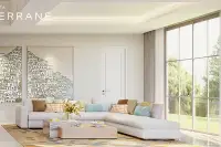 4 Bedroom House for Sale at Patta Terrane bright living room with white sectional sofa, art wall and floor-to-ceiling garden view windows