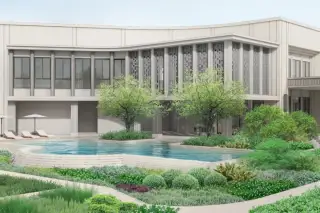 Patta Terrane luxury house exterior with outdoor swimming pool, sun loungers, umbrella, and lush landscaped gardens