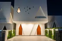 4 Bedroom House for Sale at Inara Villa modern exterior with lush landscaping