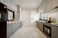 4 Bedroom House for Sale at Chieftain modern galley kitchen with grey cabinetry, built-in oven and marble floors