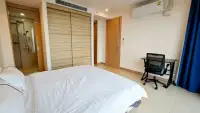 2 Bedroom Condo for Sale at The Riviera Jomtien bedroom with built-in wardrobe and ensuite shower