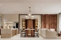 3 Bedroom House for Sale at Solava Pattaya open-plan dining area with marble island, pendant light, and burl wood feature wall