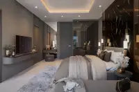 3 Bedroom Condo for Sale at Zenith 2 living room with large L-shaped sofa, TV, and balcony view of pool and buildings.