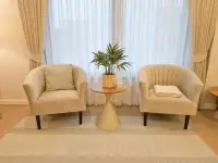 3 Bedroom House for Rent at Garden Ville 9 pair of beige armchairs with round side table and plant