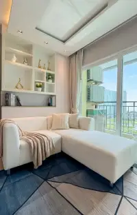 1 Bedroom Condo for Sale at La Santir white sectional sofa by balcony window with high-rise view