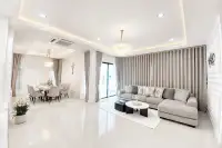 3 Bedroom House for Sale at Paradise Hill 2 open-plan living and dining area with crystal chandeliers and grey sectional sofa